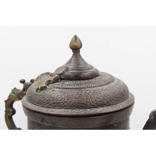 102 - A captivating 19th-century Kashmiri water samovar or kettle, crafted from copper and adorned with ex... 