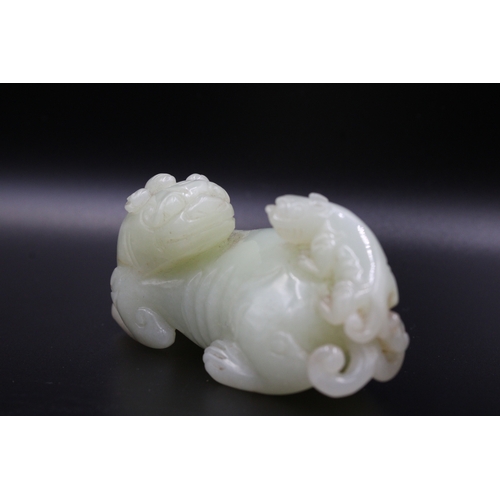 46 - This stunning Chinese jade sculpture portrays a mythical lion with its cub, showcasing intricate det... 