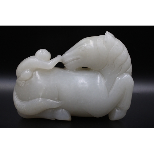 47 - This Chinese white jade sculpture from the Qing Dynasty, dating back to the 19th century, depicts a ... 