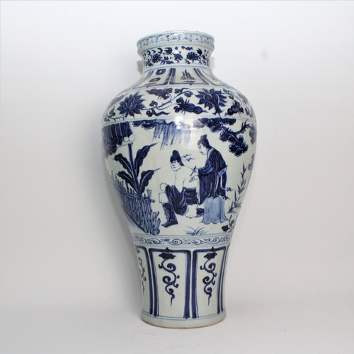 48 - This Chinese vase, from 20th century or earlier, reminiscent of the Kangxi style, stands at an impre... 