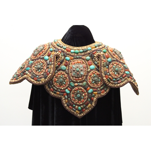 245 - Tibetan Tribal Splendor: Coat & Bracelets Adorned with Vibrant Stones

Step into the world of Tibeta... 