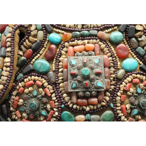 245 - Tibetan Tribal Splendor: Coat & Bracelets Adorned with Vibrant Stones

Step into the world of Tibeta... 