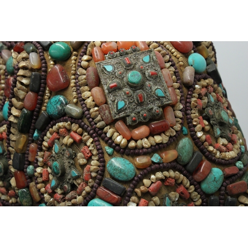 245 - Tibetan Tribal Splendor: Coat & Bracelets Adorned with Vibrant Stones

Step into the world of Tibeta... 