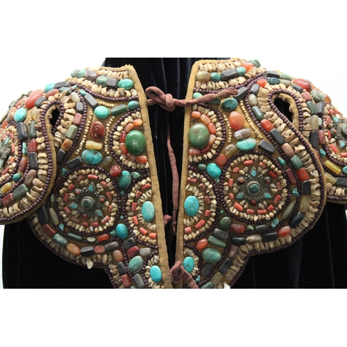 245 - Tibetan Tribal Splendor: Coat & Bracelets Adorned with Vibrant Stones

Step into the world of Tibeta... 