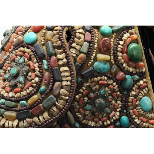 245 - Tibetan Tribal Splendor: Coat & Bracelets Adorned with Vibrant Stones

Step into the world of Tibeta... 