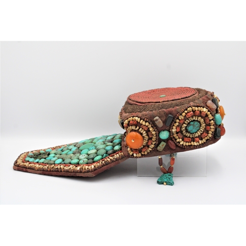 246 - Elegant Tibetan Hat: Adorned with Turquoise, Coral, Amber, and Agate

This Tibetan hat is a masterpi... 