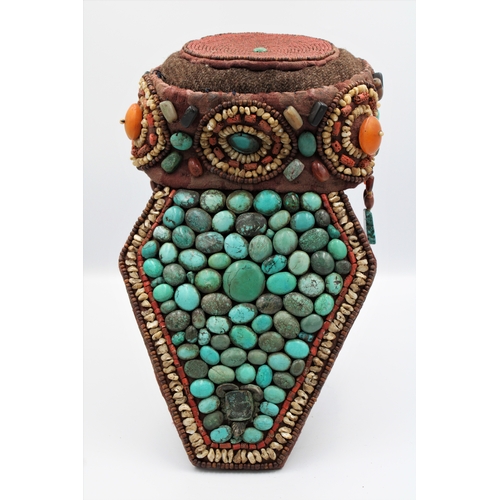 246 - Elegant Tibetan Hat: Adorned with Turquoise, Coral, Amber, and Agate

This Tibetan hat is a masterpi... 