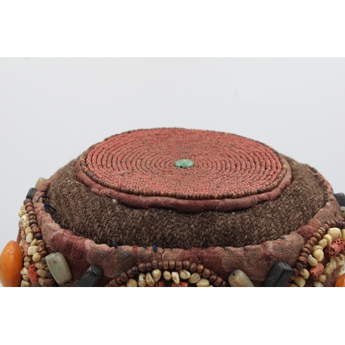 246 - Elegant Tibetan Hat: Adorned with Turquoise, Coral, Amber, and Agate

This Tibetan hat is a masterpi... 