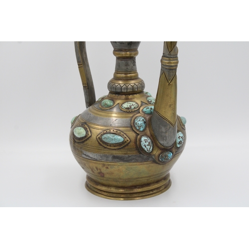 104 - This is an Islamic Bukhara bronze jug and water collector, likely used for handwashing. It is adorne... 