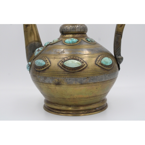 104 - This is an Islamic Bukhara bronze jug and water collector, likely used for handwashing. It is adorne... 