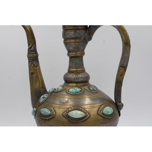 104 - This is an Islamic Bukhara bronze jug and water collector, likely used for handwashing. It is adorne... 