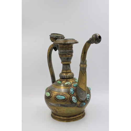 104 - This is an Islamic Bukhara bronze jug and water collector, likely used for handwashing. It is adorne... 