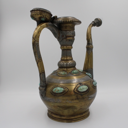 104 - This is an Islamic Bukhara bronze jug and water collector, likely used for handwashing. It is adorne... 