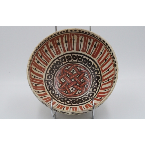 115 - An exquisite 12th century Islamic Nishapur ceramic pottery bowl showcasing vibrant orange and brown ... 