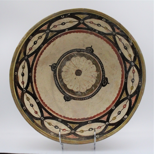 117 - This 12th-century pottery bowl hails from Nishapur and is exquisitely glazed. Its surface is adorned... 