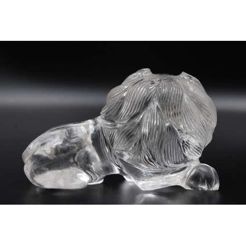 306 - Exquisite crystal or glass lion with intricate carvings, measuring approximately 7.5cm in width. A s... 