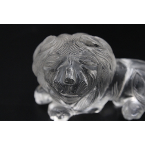 306 - Exquisite crystal or glass lion with intricate carvings, measuring approximately 7.5cm in width. A s... 