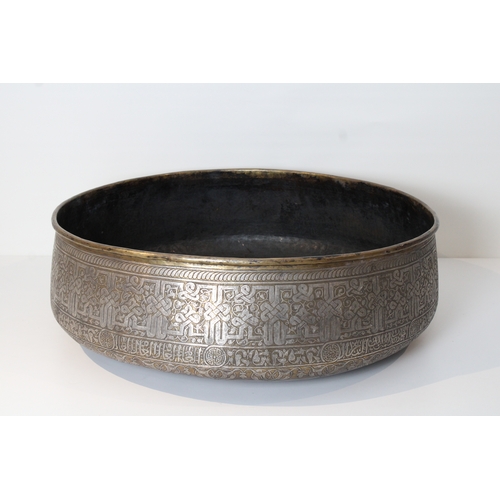 107 - Introducing a stunning large copper bowl, measuring 62cm in diameter, adorned with intricate silver ... 