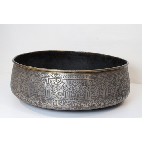 107 - Introducing a stunning large copper bowl, measuring 62cm in diameter, adorned with intricate silver ... 