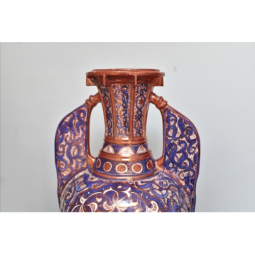 126 - This grand 19th-century Islamic Hispano pottery vase, exquisitely designed in the Alhambra style, st... 