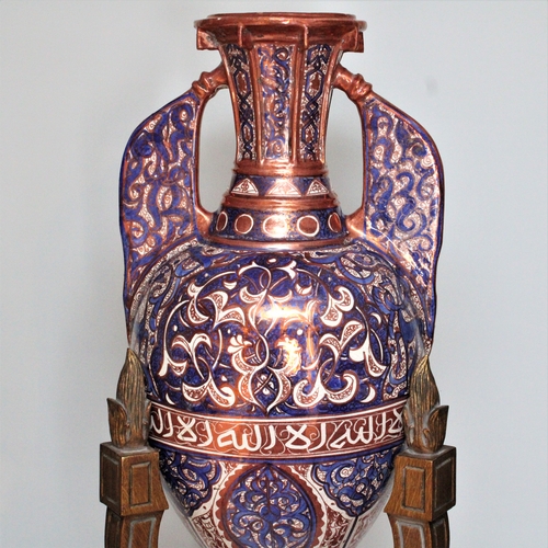 126 - This grand 19th-century Islamic Hispano pottery vase, exquisitely designed in the Alhambra style, st... 