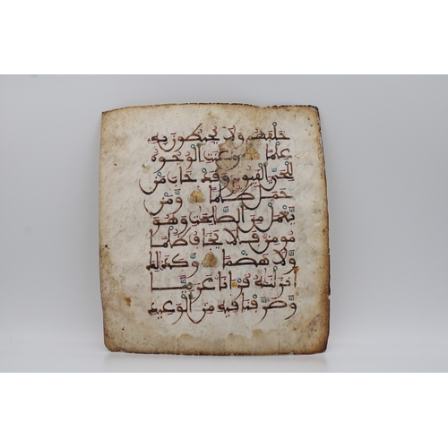 18 - A remarkable artefact is a leaf from the Quran, meticulously crafted on vellum during the 13th centu... 