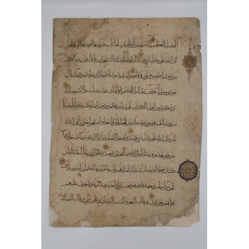 20 - A remarkable artefact is a folio from the Fatimid era Qur'an, featuring double-sided calligraphy wit... 