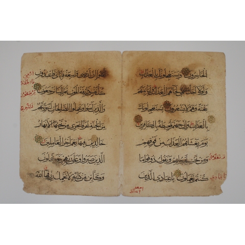 23 - These two leaves are fragments from a Mamluk Qur'an, with each leaf showcasing seven lines of meticu... 