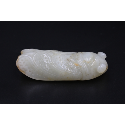 37 - This finely crafted Chinese cricket jade, originating from the late 18th to early 19th century (betw... 