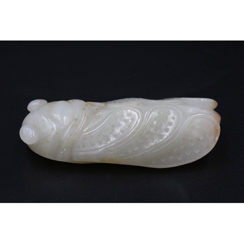 37 - This finely crafted Chinese cricket jade, originating from the late 18th to early 19th century (betw... 