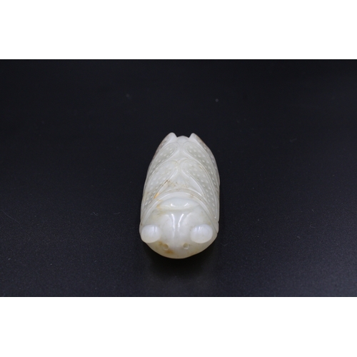 37 - This finely crafted Chinese cricket jade, originating from the late 18th to early 19th century (betw... 