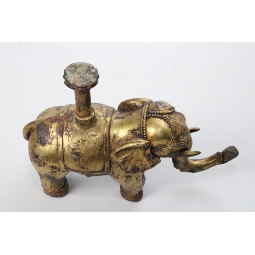 30 - Chinese Bronze Gilt Elephant with Floral Carvings: This captivating bronze gilt elephant, standing a... 