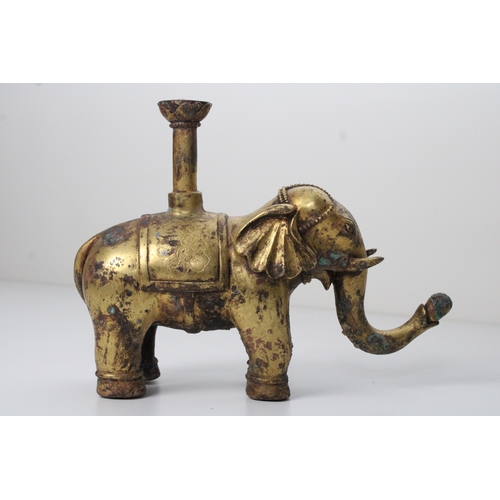 30 - Chinese Bronze Gilt Elephant with Floral Carvings: This captivating bronze gilt elephant, standing a... 