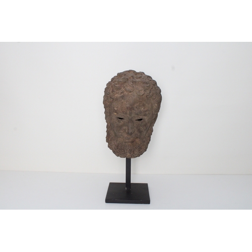 311 - Indo-Greek Bronze Head with Curled Hair: This Indo-Greek bronze head, featuring intricately curled h... 