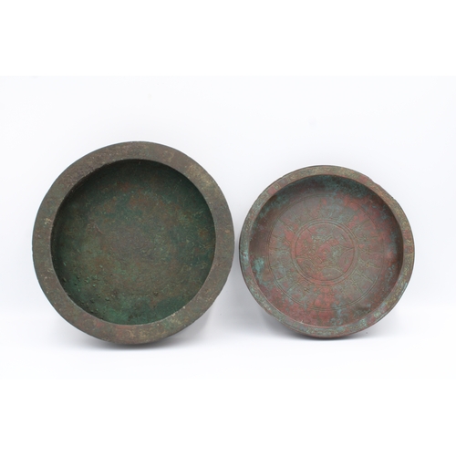 128 - Two 12th Century Islamic Bronze Plates: This is an exquisite pair of bronze plates hailing from the ... 