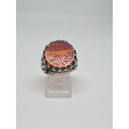 244 - An Islamic silver ring adorned with an engraved agate stone, reflecting the Timurid style.