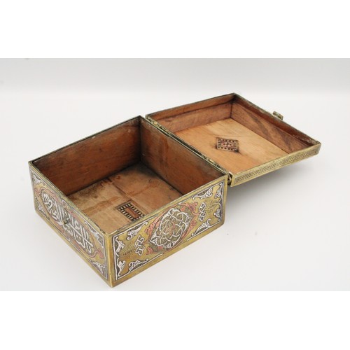 19 - An Islamic Egyptian Brass Box with Silver Inlay and Wooden Inside

Height: Approximately 8.2cm
Lengt... 