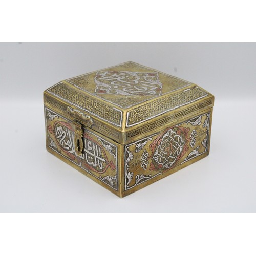 19 - An Islamic Egyptian Brass Box with Silver Inlay and Wooden Inside

Height: Approximately 8.2cm
Lengt... 