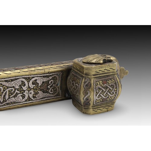 20 - An Islamic Egyptian Silver Inlaid Inkwell Qalamdan

Length: Approximately 23cm