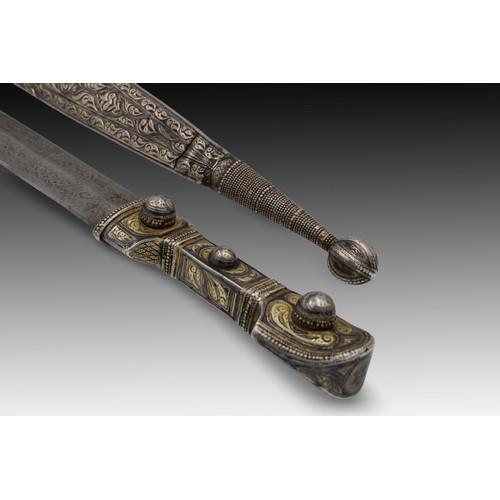 23 - A Caucasian Sword with an Engraved Silver Handle and Niello Decorations from the 19th Century. 

Len... 