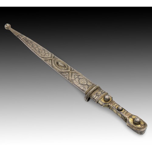 23 - A Caucasian Sword with an Engraved Silver Handle and Niello Decorations from the 19th Century. 

Len... 