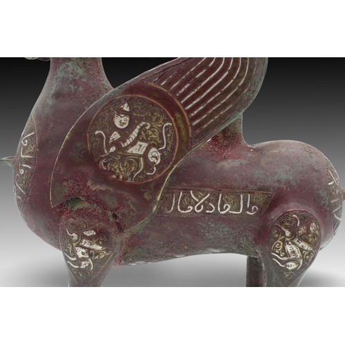 24 - An Islamic Bronze Animal-like Figure Oil Lamp from the 20th Century with Silver Inlay & Islamic Call... 