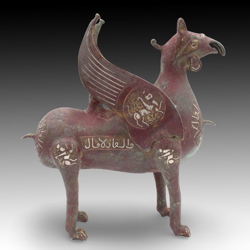 24 - An Islamic Bronze Animal-like Figure Oil Lamp from the 20th Century with Silver Inlay & Islamic Call... 