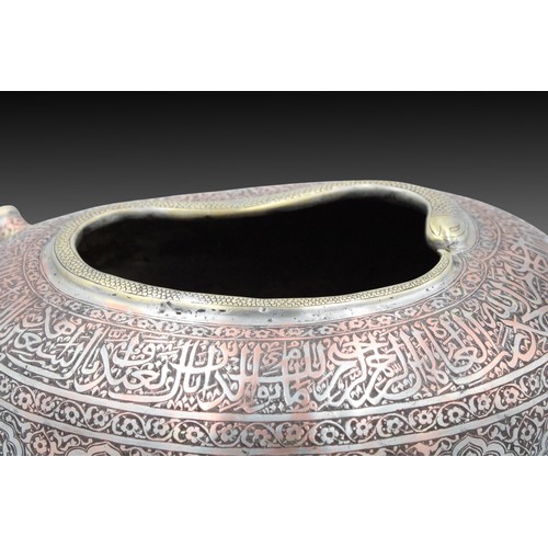 61 - An Islamic Copper Kashkul (Begging Bowl) with Islamic Calligraphy Snake Design on the Tip

Height: A... 