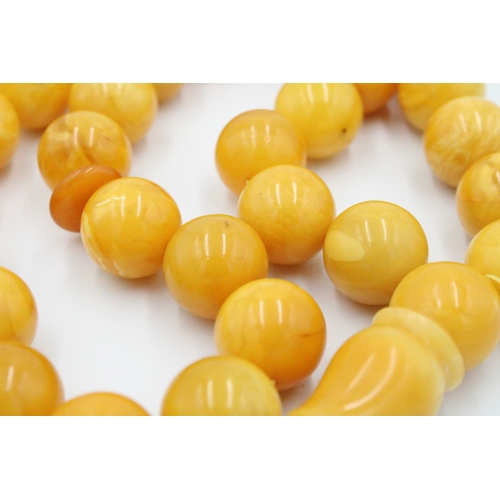 63 - An Islamic Large Butterscotch Amber Prayer Beads with White Metal Tassel  

Weight: 188g with White ... 