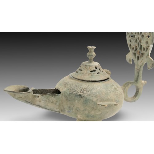 69 - An Islamic Bronze Oil Lamp from the 12th Century with Beautiful Open Work on the Base, Lid and Handl... 