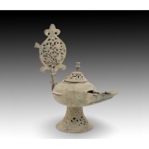 69 - An Islamic Bronze Oil Lamp from the 12th Century with Beautiful Open Work on the Base, Lid and Handl... 