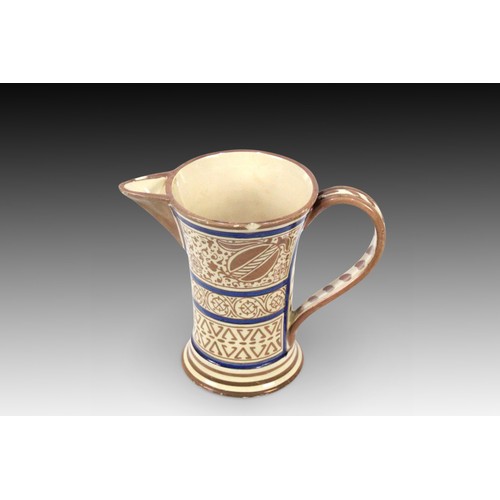 86 - An Islamic Moresque Jug from the 19th Century decorated with Bands of Foliate and Geometric Motifs

... 