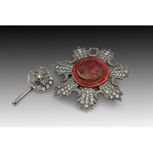 91 - An Islamic Ottoman White Metal Medal Brooch with Red Enamel and Islamic Calligraphy: Approximately 7... 