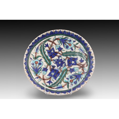 99 - A Turkish Kutahya Glazed Pottery Plate from the 19th Century with a Beautiful Floral Design in Blue ... 